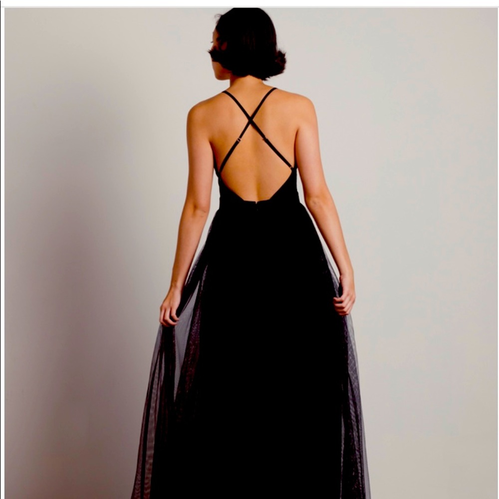 Brand new, never worn. Black long open back dress